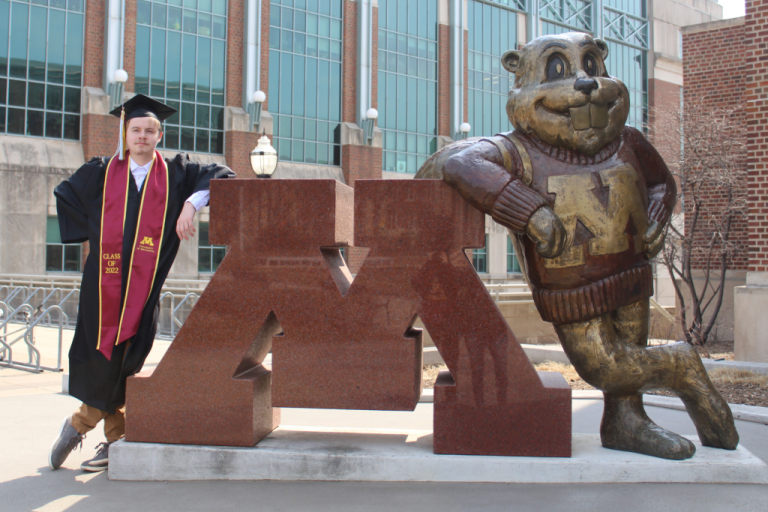 Nick next to Goldy statue