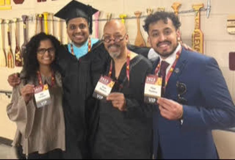 Neil Mendonca with family at graduation.