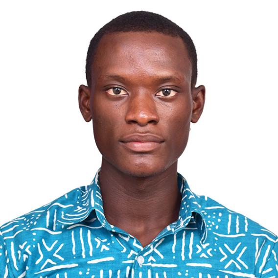 Portrait image of Desmond Asante in open-neck robin's egg blue print shirt